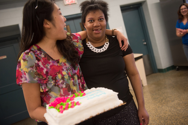 Shantell with Kathy, who carries a decorated cake