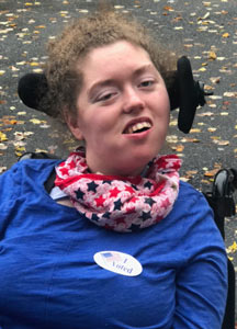 photo of Haley smiling and wearning an I Voted sticker