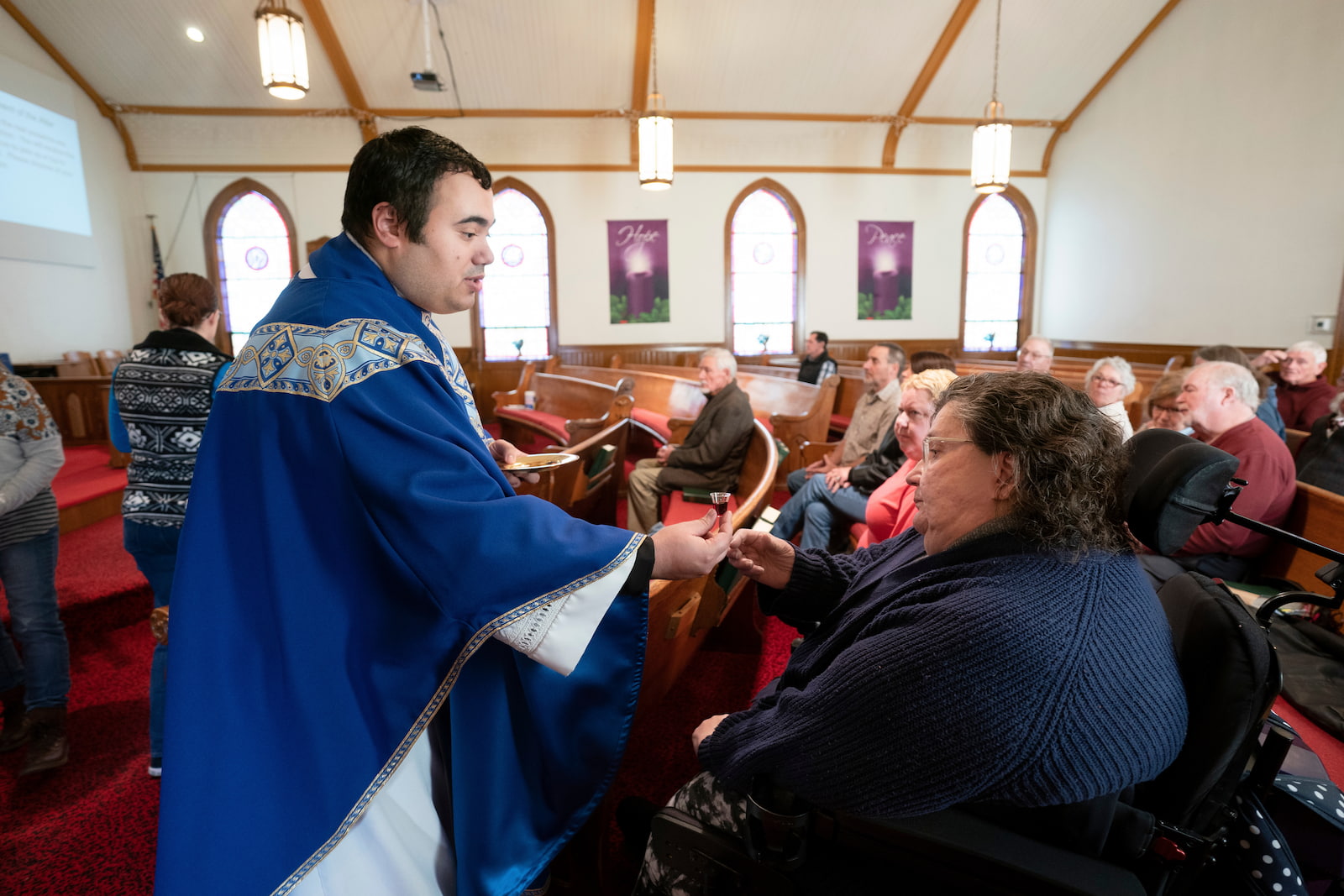 Cindy receiving communion in church