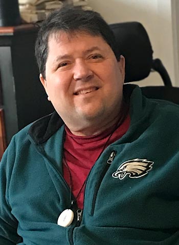 Frank Leonetti, smiling and wearing a Philadelphia Eagles fleece jacket