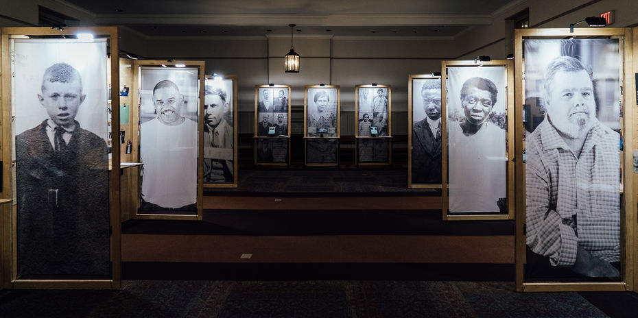 File Life installation view of large vertical black and white portraits on banners
