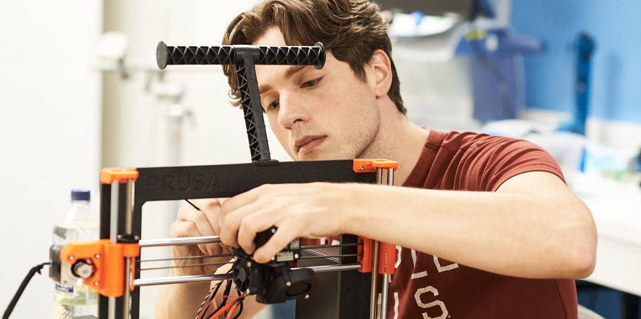 man working with a 3D printer