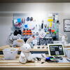 various assistive tech including switches and adapted toys arranged on a table
