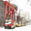Snow scene features food trucks along Montgomery Avenue next toTemple's student center