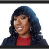 Professional headshot of Icylee Basketbill, a Black woman with long black wavy hair, who wears a dark jacket over a red top, and silver heart hoop earrings