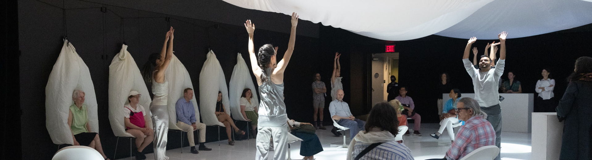 Rhythm Bath performance space with dancers and viewers under billowing white fabric