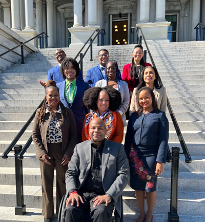 Ten Black leaders pose together on government building steps, Washington DC